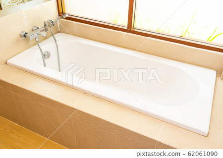 Beautiful White bathtub decoration interior of bathroom Beautiful White bathtub decoration interior of bathroom 62061090