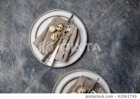 Easter festive table setting with quail eggs. top view 62061749