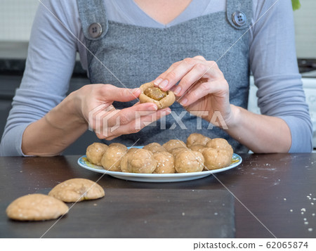 Preparation of Egyptian cookies. Ramadan sweets. Preparation of Egyptian cookies. Ramadan sweets. 62065874