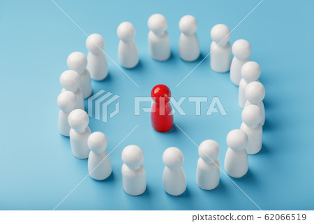 A team of white people stands around and listens 62066519