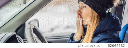 Woman in a car during a snowfall, problems on the road BANNER, LONG FORMAT Woman in a car during a snowfall, problems on the road BANNER, LONG FORMAT 62066682
