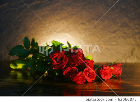 Red roses flower bouquet on rustic wood and Red roses flower bouquet on rustic wood and 62066873