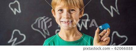 BANNER, LONG FORMAT Six-year old boy shows myofunctional trainer. Helps equalize the growing teeth BANNER, LONG FORMAT Six-year old boy shows myofunctional trainer. Helps equalize the growing teeth 62066888