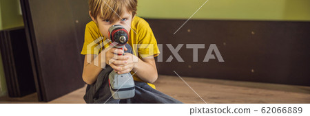 Boy assembling furniture. Boy helping his dad at home. Happy Family concept BANNER, LONG FORMAT Boy assembling furniture. Boy helping his dad at home. Happy Family concept BANNER, LONG FORMAT 62066889