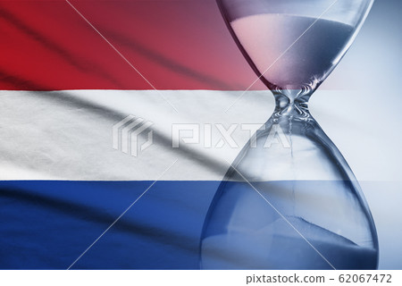 Hourglass over the flag of the Netherlands 62067472