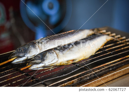 saba fish grilled on grill for sale in the street 62067727
