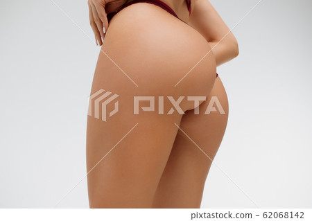 Crop alluring female with hands on buttocks Crop alluring female with hands on buttocks 62068142
