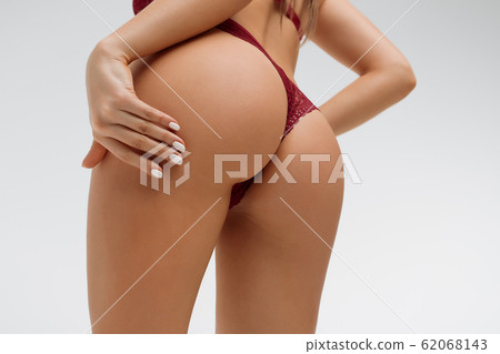 Crop alluring female with hands on buttocks Crop alluring female with hands on buttocks 62068143