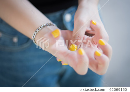 sick woman with trigger finger pain; portrait of sick woman with trigger finger pain; portrait of 62069160