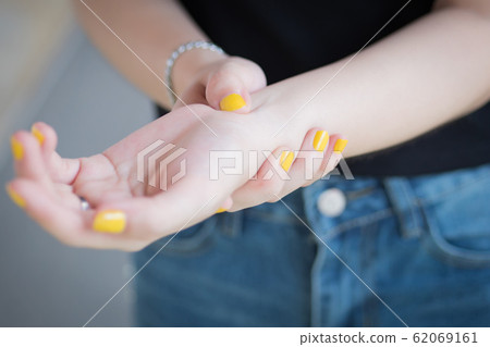 sick woman with trigger finger pain; portrait of sick woman with trigger finger pain; portrait of 62069161