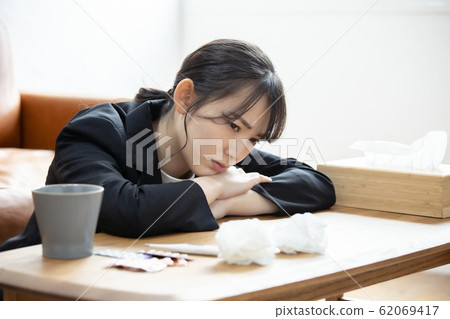 A young woman with poor physical condition 62069417