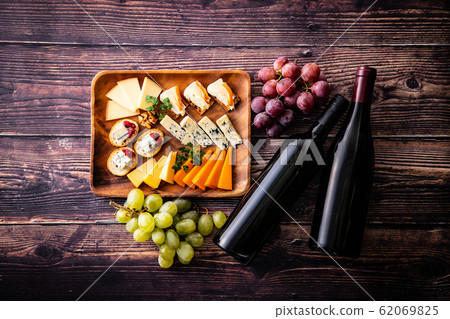 Cheese platter and wine bottle Cheese platter and wine bottle 62069825