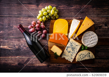 Cheese platter and wine bottle 62069839