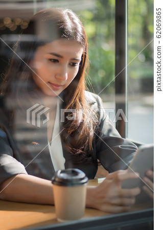 business woman using computer tablet; portrait of 62069865
