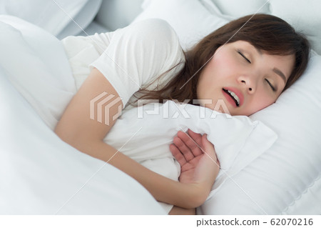 tired exhausted stressed woman snoring; portrait 62070216