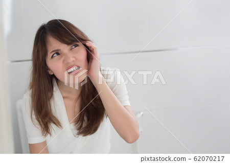 upset woman in toilet by diarrhea, constipation, 62070217