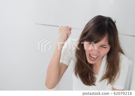 angry woman in toilet by diarrhea, constipation, angry woman in toilet by diarrhea, constipation, 62070218