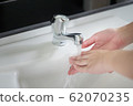 happy woman handwash; closeup hand portrait of 62070235