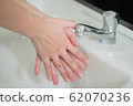 happy woman handwash; closeup hand portrait of 62070236