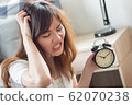 angry woman in trouble with late time; portrait of 62070238