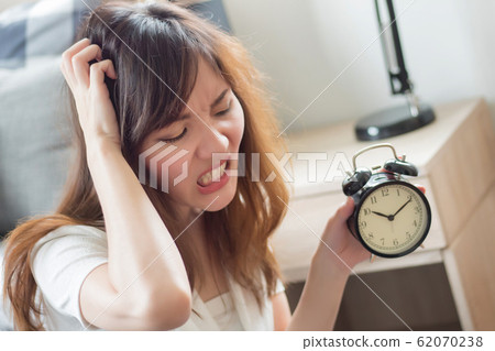 angry woman in trouble with late time; portrait of angry woman in trouble with late time; portrait of 62070238