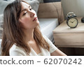 bored woman in trouble with late time; portrait of 62070242