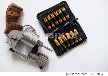 .44 magnum revolver gun with bullet on white 62070375
