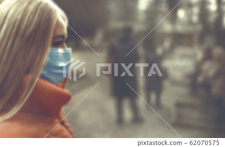 Woman wearing face mask because of air pollution Woman wearing face mask because of air pollution 62070575