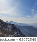 Warm sun with mountain ridge 62072549