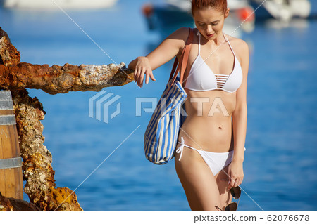 WOman at the seaside. Adriatic, yachts in the WOman at the seaside. Adriatic, yachts in the 62076678