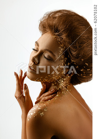 model girl with holiday golden shiny professional makeup. model girl with holiday golden shiny professional makeup. 62078102