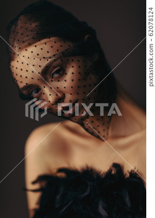 beauty elegant girl posing in black veil 62078124