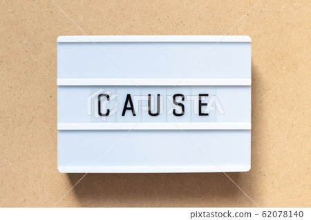 White lightbox with word cause on wood background 62078140