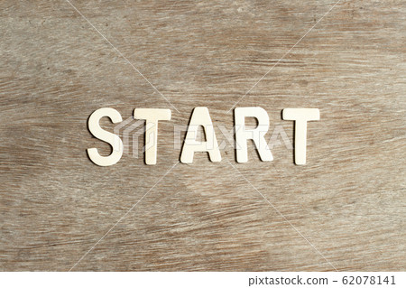 Alphabet letter in word start on wood background Alphabet letter in word start on wood background 62078141