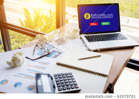 computer tablet with screen for buy or sell bitcoin on workspace table in modern office ,bitcoin electronic money concept. computer tablet with screen for buy or sell bitcoin on workspace table in modern office ,bitcoin electronic money concept. 62079781