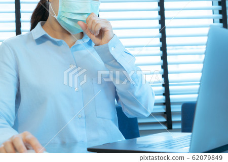 woman cough with face mask protection while working, Coronavirus, air pollution, allergic sick woman woman cough with face mask protection while working, Coronavirus, air pollution, allergic sick woman 62079849