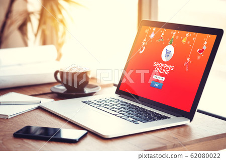 online shopping website on laptop screen for buy gift on seasonal and holiday for Christmas and new year gift. online shopping concept online shopping website on laptop screen for buy gift on seasonal and holiday for Christmas and new year gift. online shopping concept 62080022