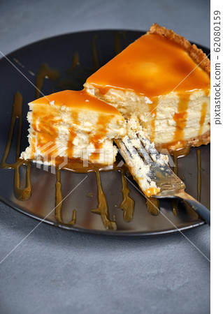 Sweet dessert from air curd cheesecake poured with 62080159