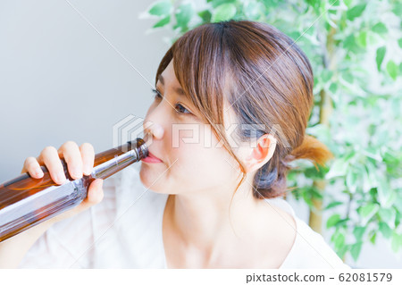 Image of drinking at home, person, adult, female, liquor, drink, relax, lifestyle, home break, change of mood Image of drinking at home, person, adult, female, liquor, drink, relax, lifestyle, home break, change of mood 62081579