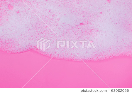 White foam with bubbles on pink background White foam with bubbles on pink background 62082066