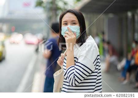 Woman wearing face mask protect filter against air Woman wearing face mask protect filter against air 62082191