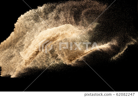 Brown dry river sand explosion isolated on black background. Abstract sand splash. 62082247