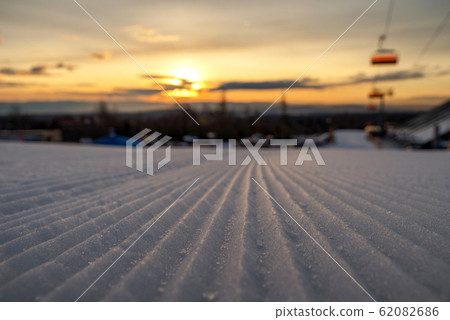 Newly groomed snow on empty ski slope at resort Tatranska Lomnica, Slovakia Newly groomed snow on empty ski slope at resort Tatranska Lomnica, Slovakia 62082686