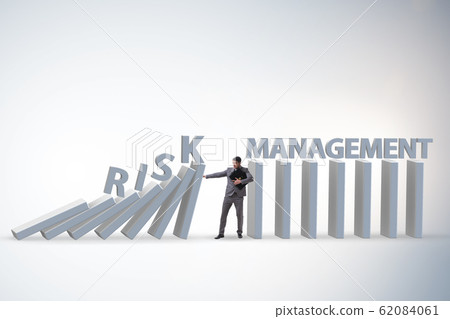 Businessman in risk management concept Businessman in risk management concept 62084061