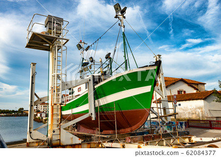 fishing boat in dry dock for repairs 62084377