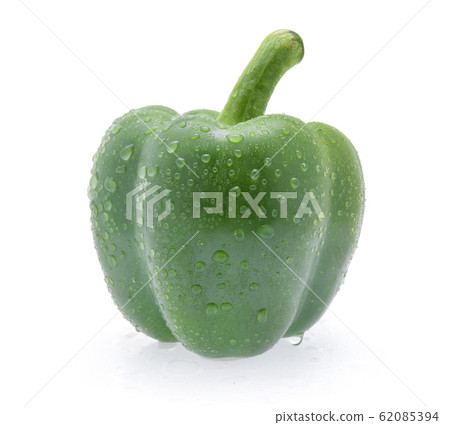 Green pepper with drops of water on white 62085394