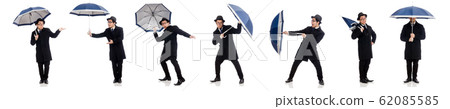 Young man with umbrella isolated on white Young man with umbrella isolated on white 62085585