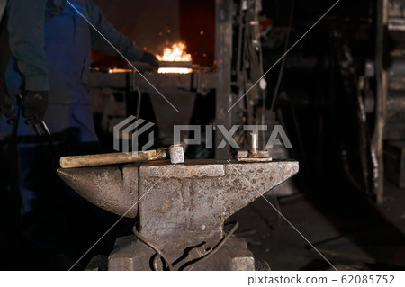 the hammer lies on the anvil in the forge while the hammer lies on the anvil in the forge while 62085752