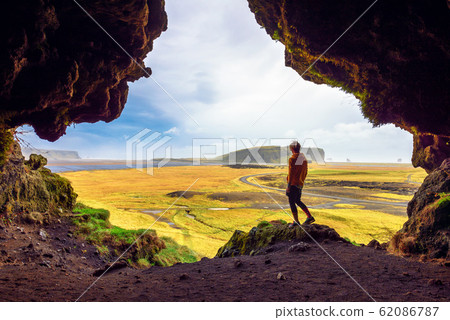 Hiker in the Loftsalahellir Cave near the village of Vik in Iceland 62086787