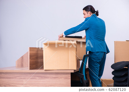 Young handsome businessman being fired from his work 62087120